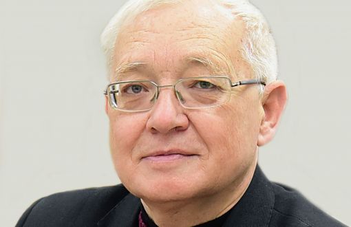 Zdjęcie portretowe: prof. Volodymyr Mosorov w ciemnej marynarce na jasnym tle.